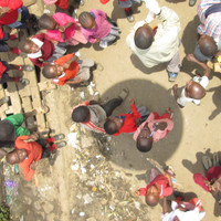 A direct look down from an aerial balloon to people looking up