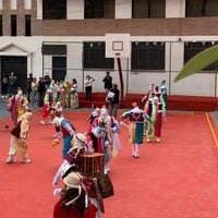 People in costumes walking around a playground.