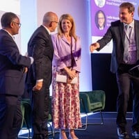 This photo shows the high-level panel during the opening plenary, including: The Rt Hon. the Baroness Chapman of Darlington, Minister of State for Development in the UK, H.E. Mehmet Şimşek, Minister of Finance and Treasury for the Republic of Türkiye, and Negusu Aklilu, chief executive officer of the COP32 presidency secretariat office.
