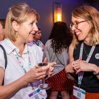 This photo shows participants networking at the drinks reception after the summit.