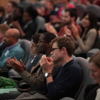 Audience members applaud as Fatima Denton outlines why Africa should seize climate change as a business opportunity (Photo: Julius Honnor/IIED)