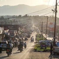 Increasingly dense urbanisation means that Fort Portal is changing. Not everyone is able to make a living from agriculture; food vending is one of the new opportunities this growing town provides. After sunset, vendors set up along these roads to serve low-income locals and travellers. They sell a variety of foods, from traditional vegetable stews and chapattis to nyama choma (grilled meats) (Photo: Sven Torfinn/Panos Pictures)