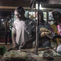 Chris employs two people at his chapatti stall on the main road of Fort Portal. With the profit he can sustain his family and rent his home (Photo: Sven Torfinn/Panos Pictures)