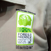 Close-up view of a shirt featuring the Bwindi Specialist Guides Group badge
