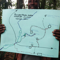 A man holding a map showing a trail